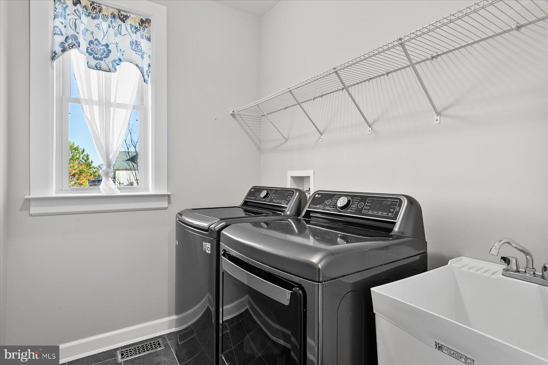 20822 Cormorant Way Ocean View, DE 19970 - Photo 49 of 91 a utility room with dryer and washer