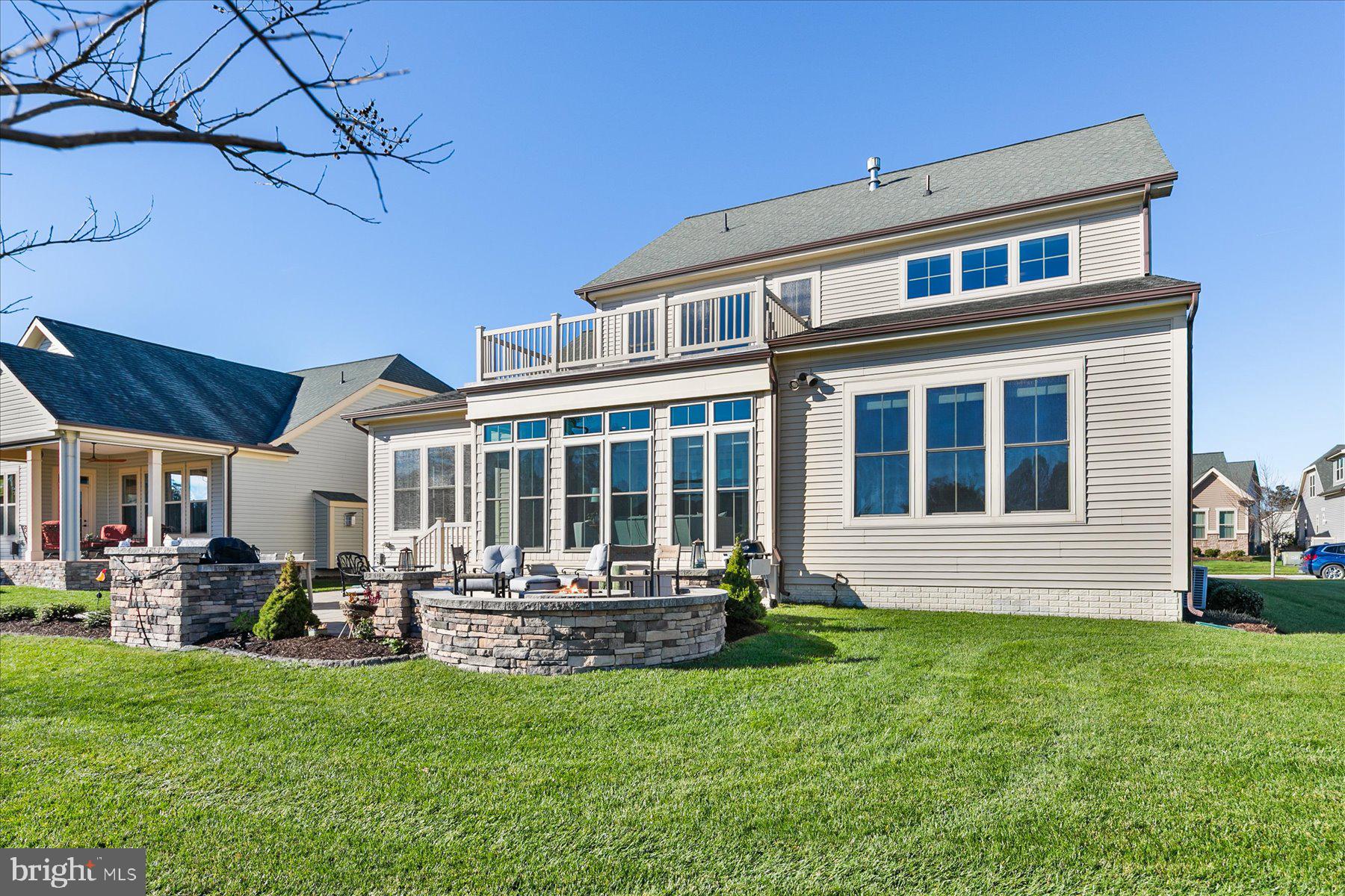 20822 Cormorant Way Ocean View, DE 19970 - Photo 59 of 91 a front view of house with yard and outdoor seating
