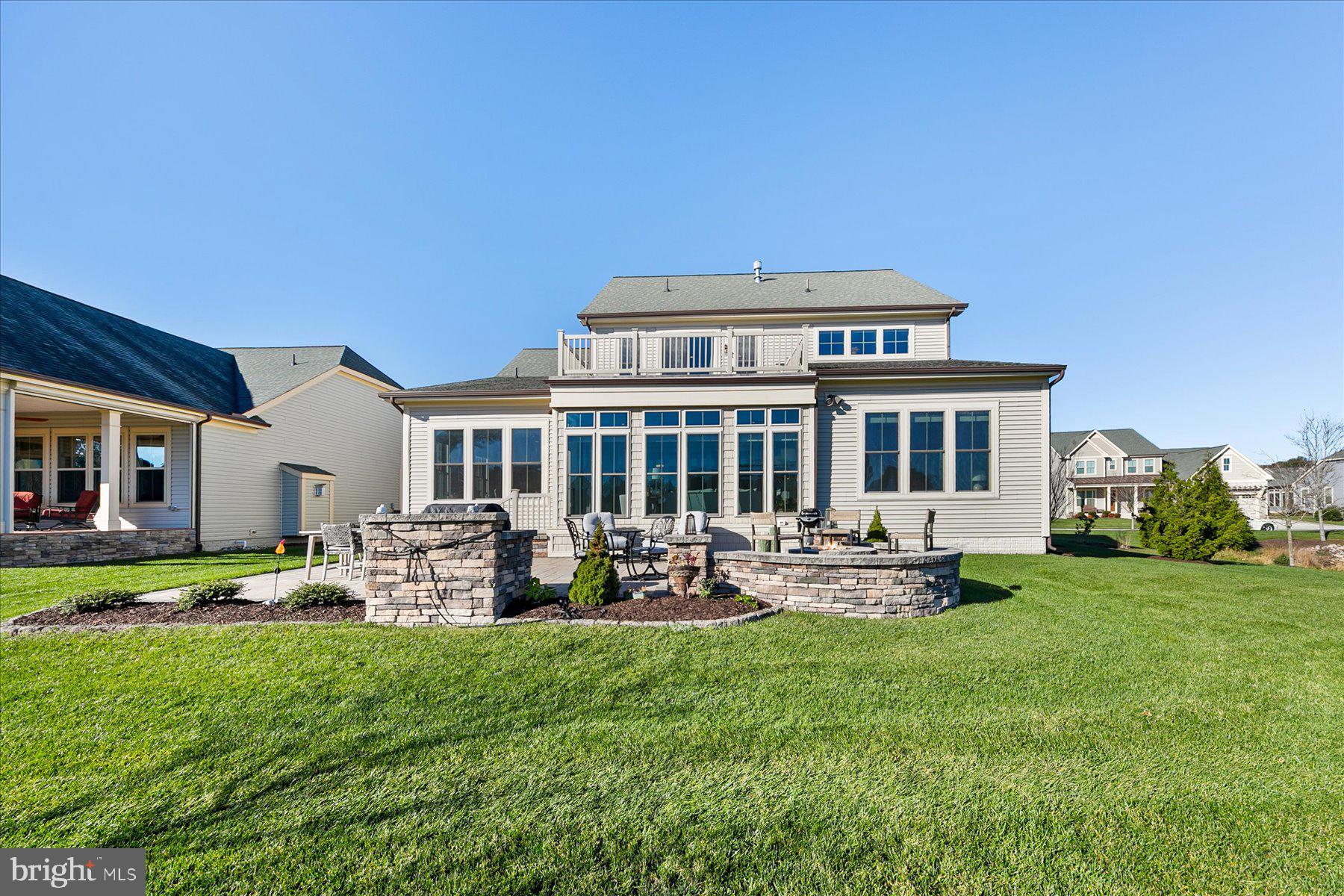 20822 Cormorant Way Ocean View, DE 19970 - Photo 60 of 91 a view of a house with backyard sitting area and garden