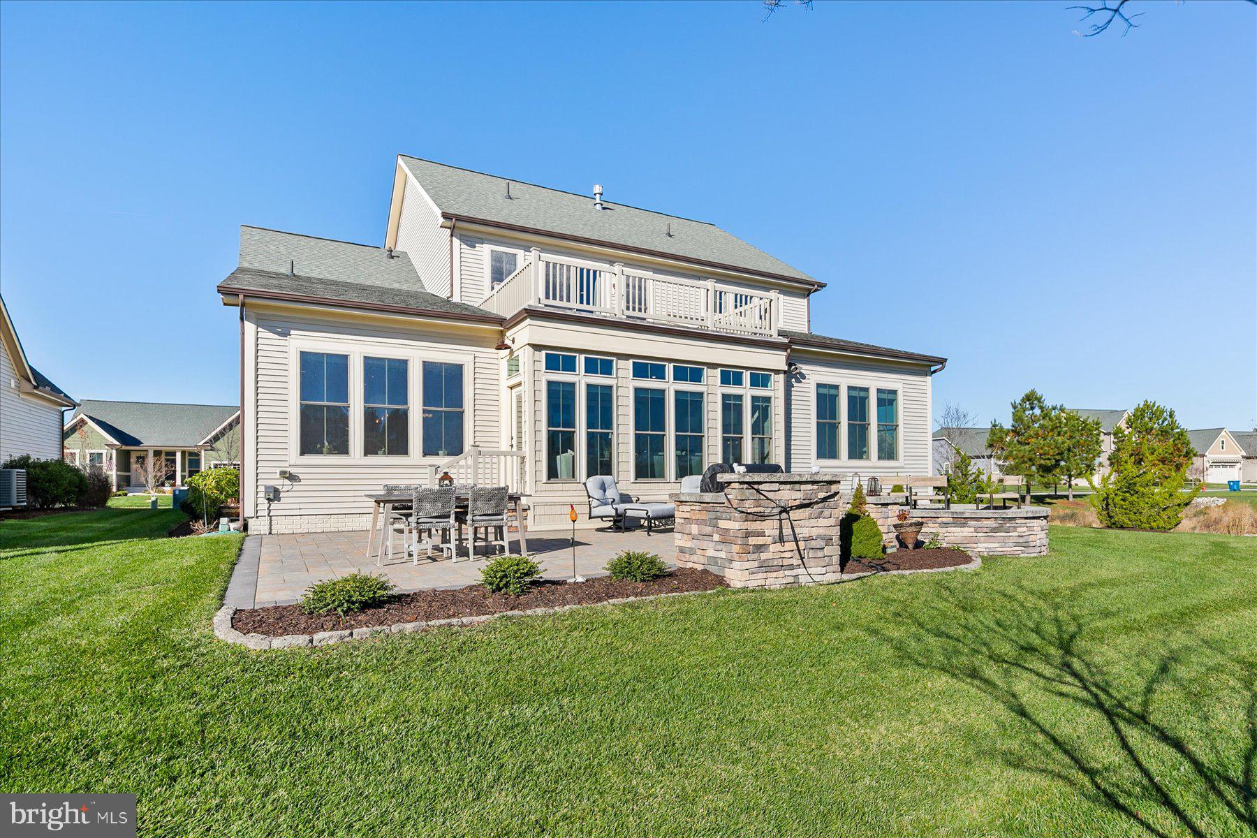 20822 Cormorant Way Ocean View, DE 19970 - Photo 61 of 91 a view of a house with backyard sitting area and garden