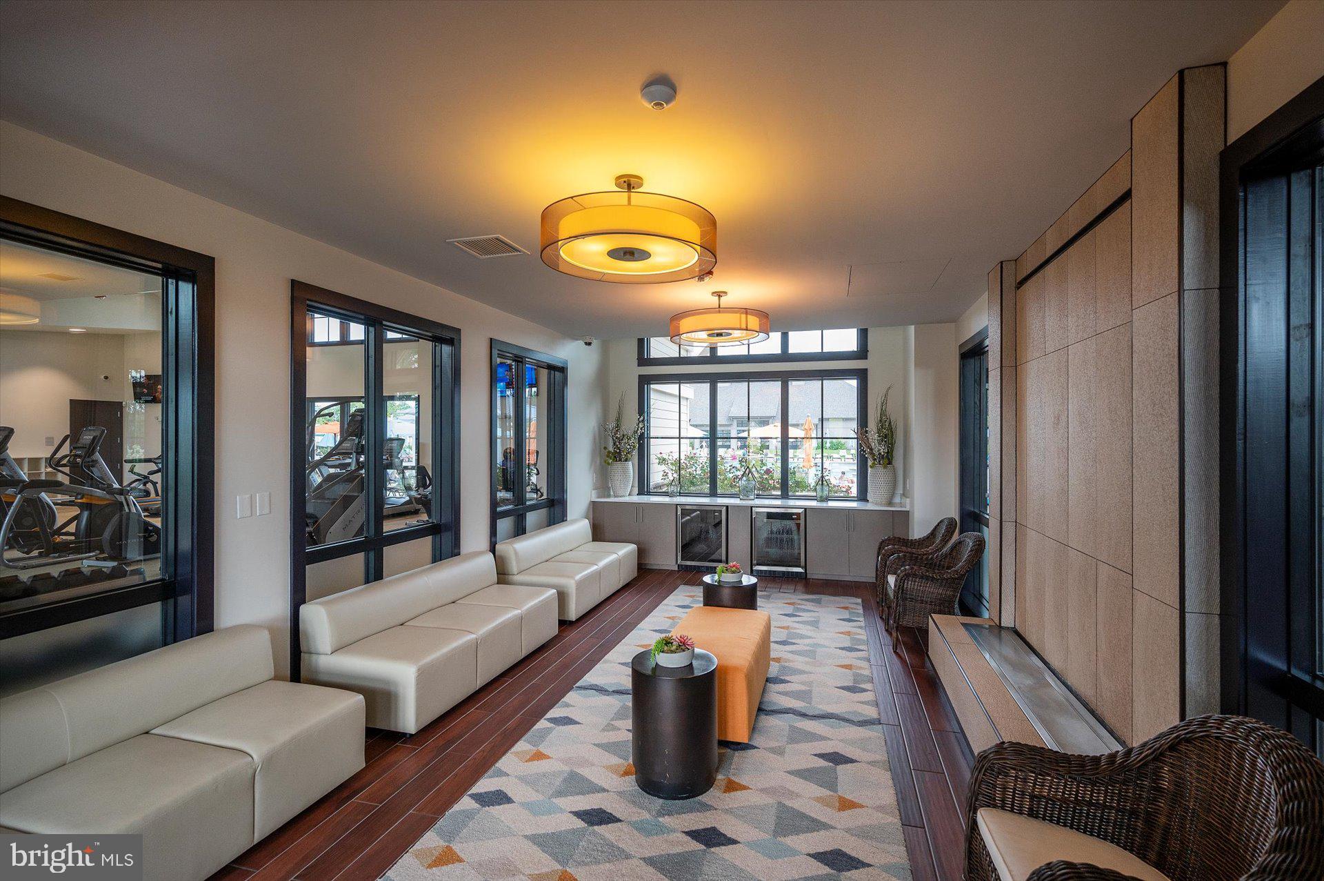 20822 Cormorant Way Ocean View, DE 19970 - Photo 86 of 91 a living room with furniture and floor to ceiling windows