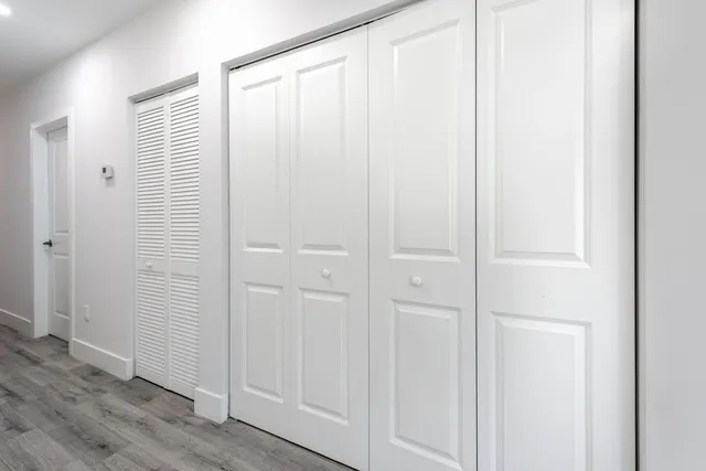 an empty room with wooden floor