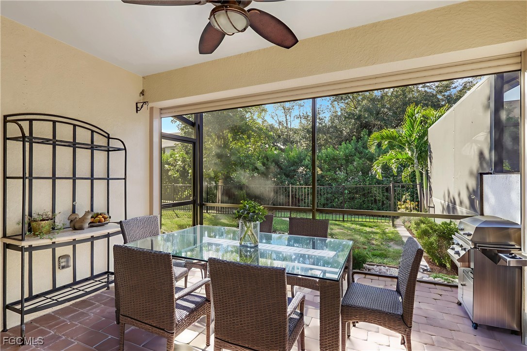 a dining room with furniture water view and a floor to ceiling window