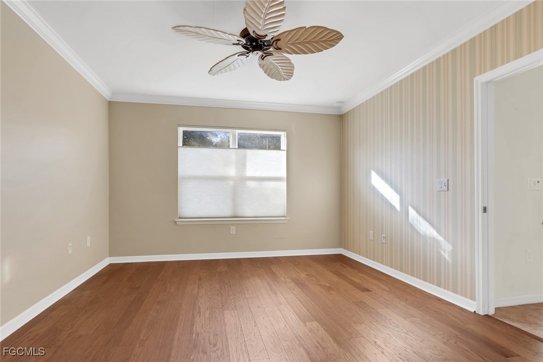 4210 Dutchess Park Road Fort Myers, FL 33916 - Photo 12 of 36 wooden floor in an empty room with a window