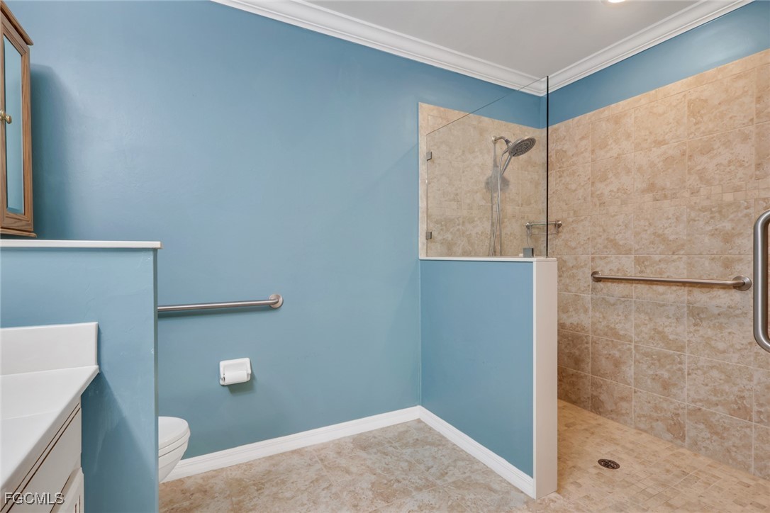 4210 Dutchess Park Road Fort Myers, FL 33916 - Photo 14 of 36 a bathroom with a shower and a toilet