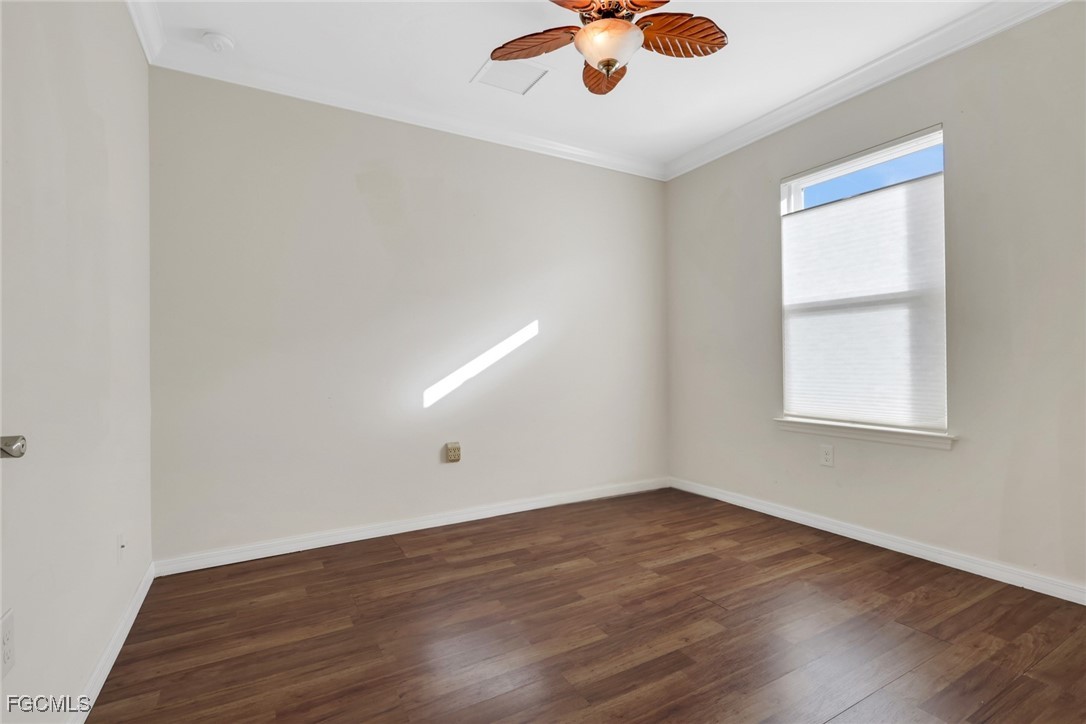 4210 Dutchess Park Road Fort Myers, FL 33916 - Photo 15 of 36 wooden floor in an empty room with a window
