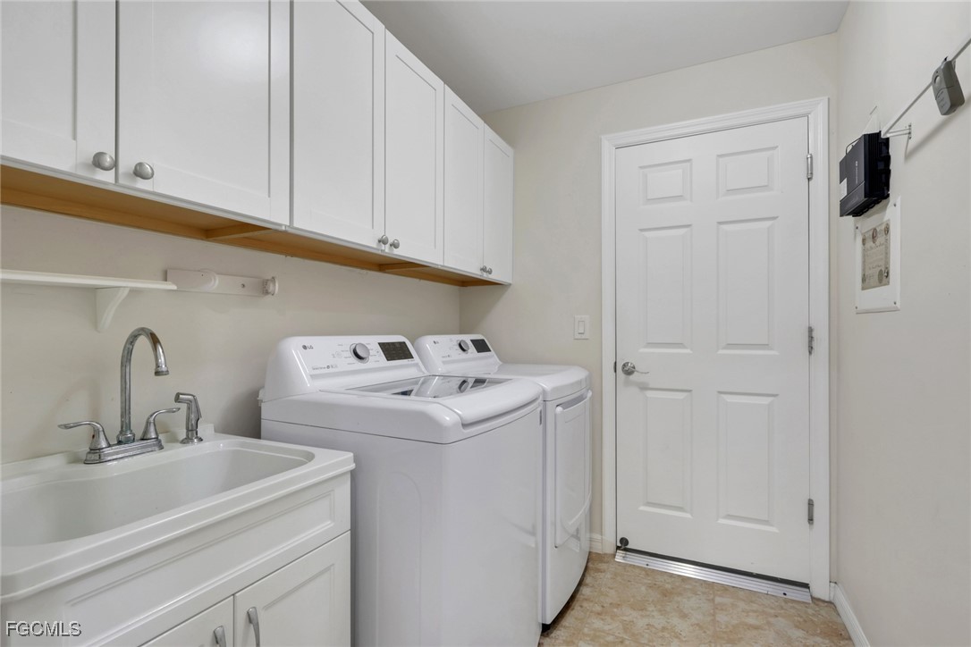 4210 Dutchess Park Road Fort Myers, FL 33916 - Photo 16 of 36 a utility room with dryer and washer