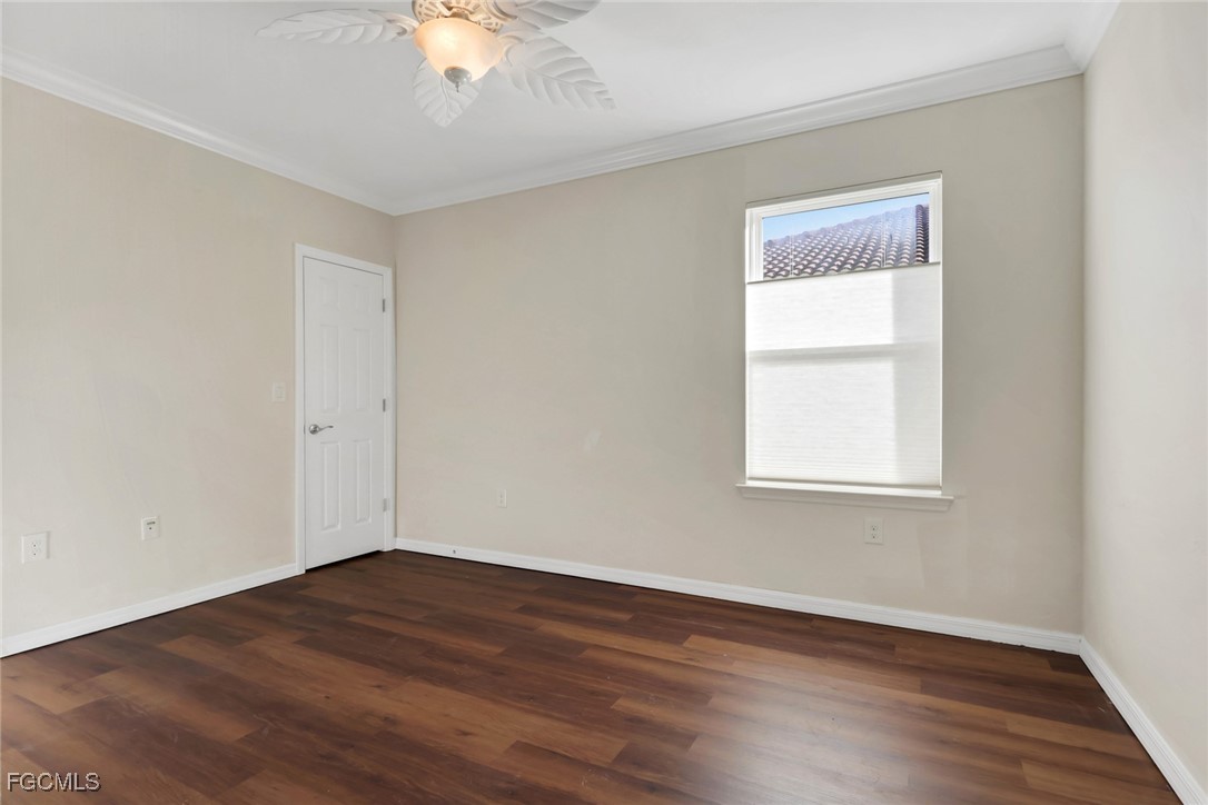 4210 Dutchess Park Road Fort Myers, FL 33916 - Photo 18 of 36 an empty room with wooden floor and windows