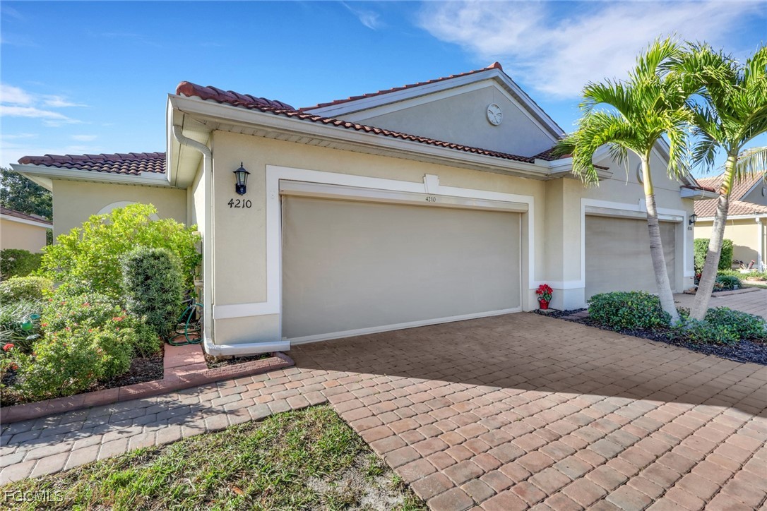 4210 Dutchess Park Road Fort Myers, FL 33916 - Photo 2 of 36 a front view of a house with plants