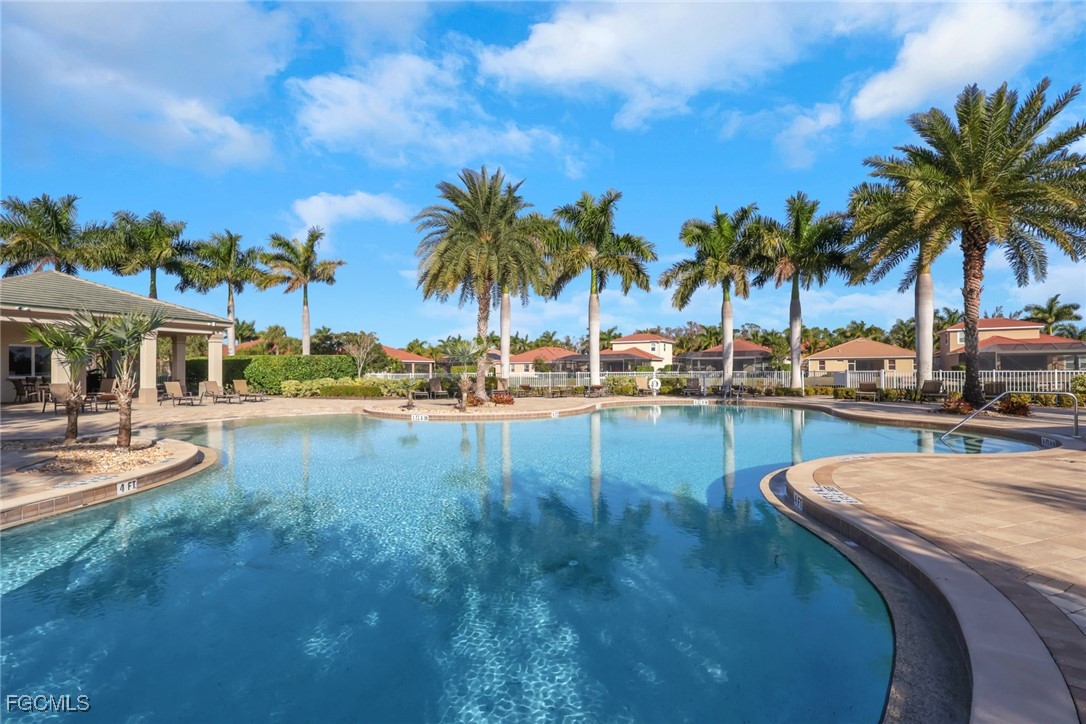 4210 Dutchess Park Road Fort Myers, FL 33916 - Photo 23 of 36 a swimming pool with outdoor seating and yard