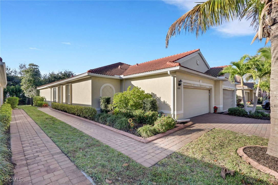 4210 Dutchess Park Road Fort Myers, FL 33916 - Photo 3 of 36 a front view of a house with garden
