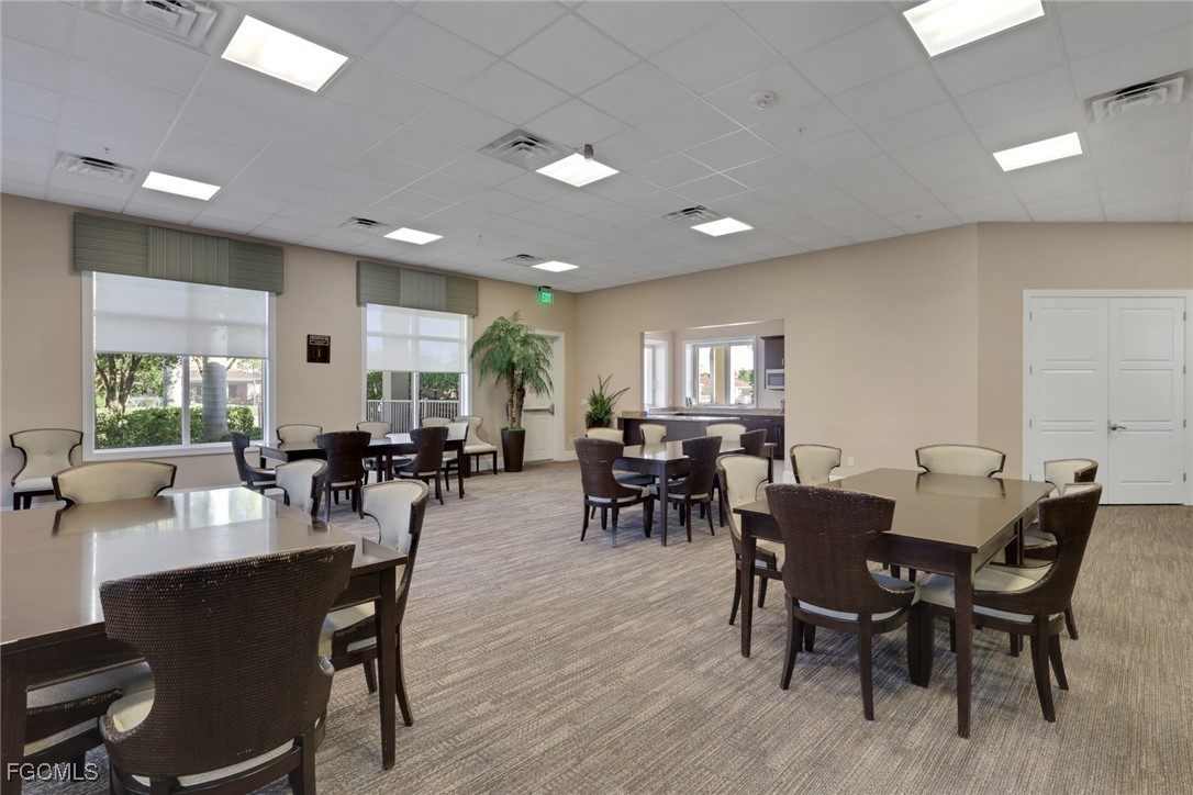 4210 Dutchess Park Road Fort Myers, FL 33916 - Photo 35 of 36 a view of a dining room with furniture window and wooden floor