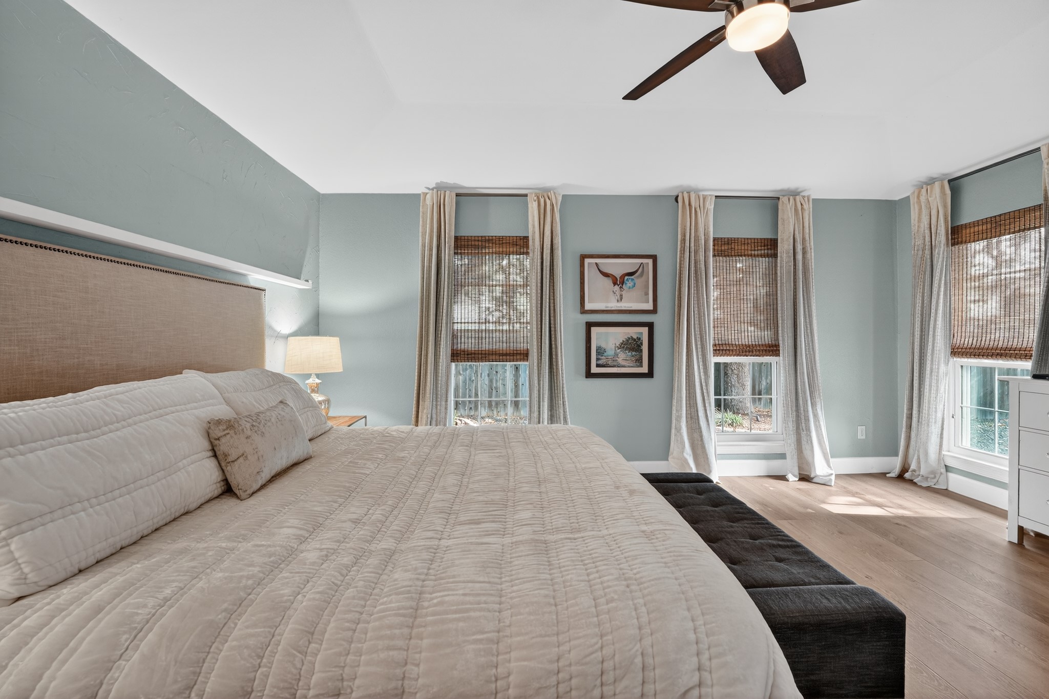 1811 Old Mill Road Cedar Park, TX 78613 - Photo 19 of 39 Relax in a generously sized bedroom, featuring vaulted ceilings and polished hardwood flooring.