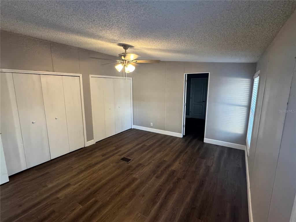 5254 Mt Olive Road Polk City, FL 33868 - Photo 13 of 19 a view of empty room with wooden floor