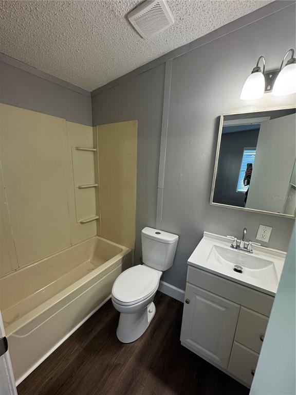 5254 Mt Olive Road Polk City, FL 33868 - Photo 17 of 19 a bathroom with a sink toilet and shower