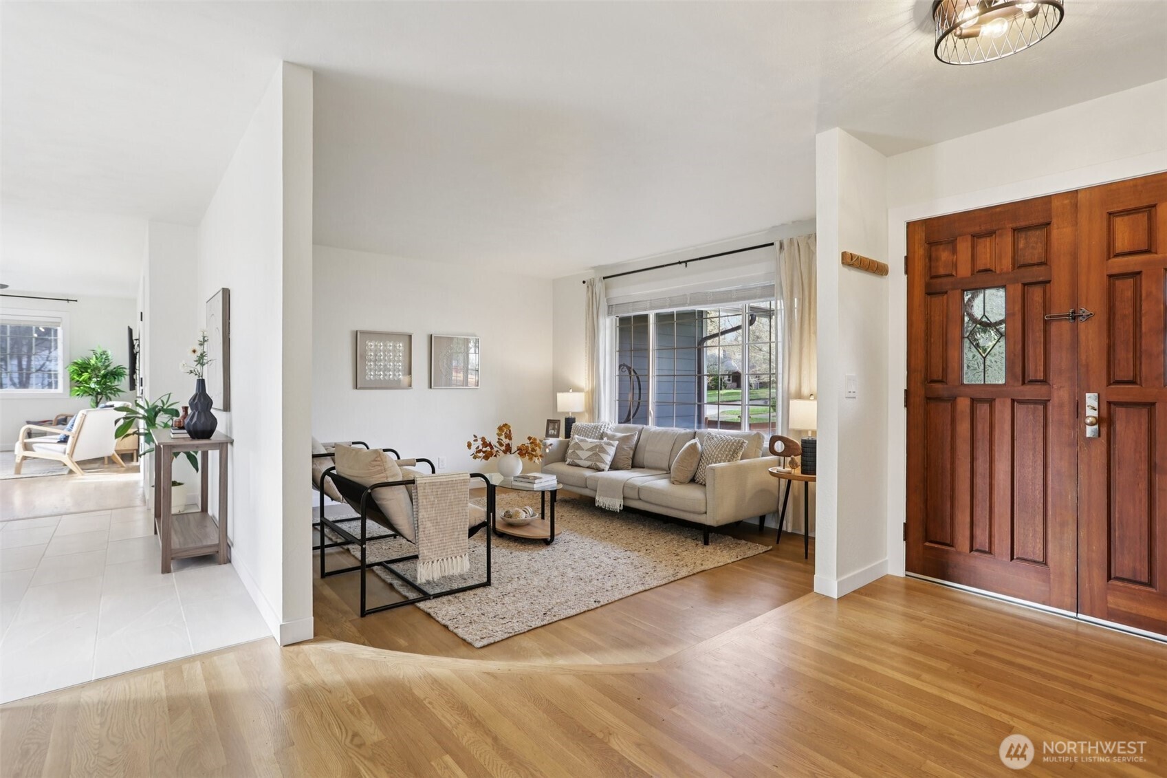 9002 34th Avenue Southwest Seattle, WA 98126 - Photo 12 of 39 a living room with furniture and a wooden floor