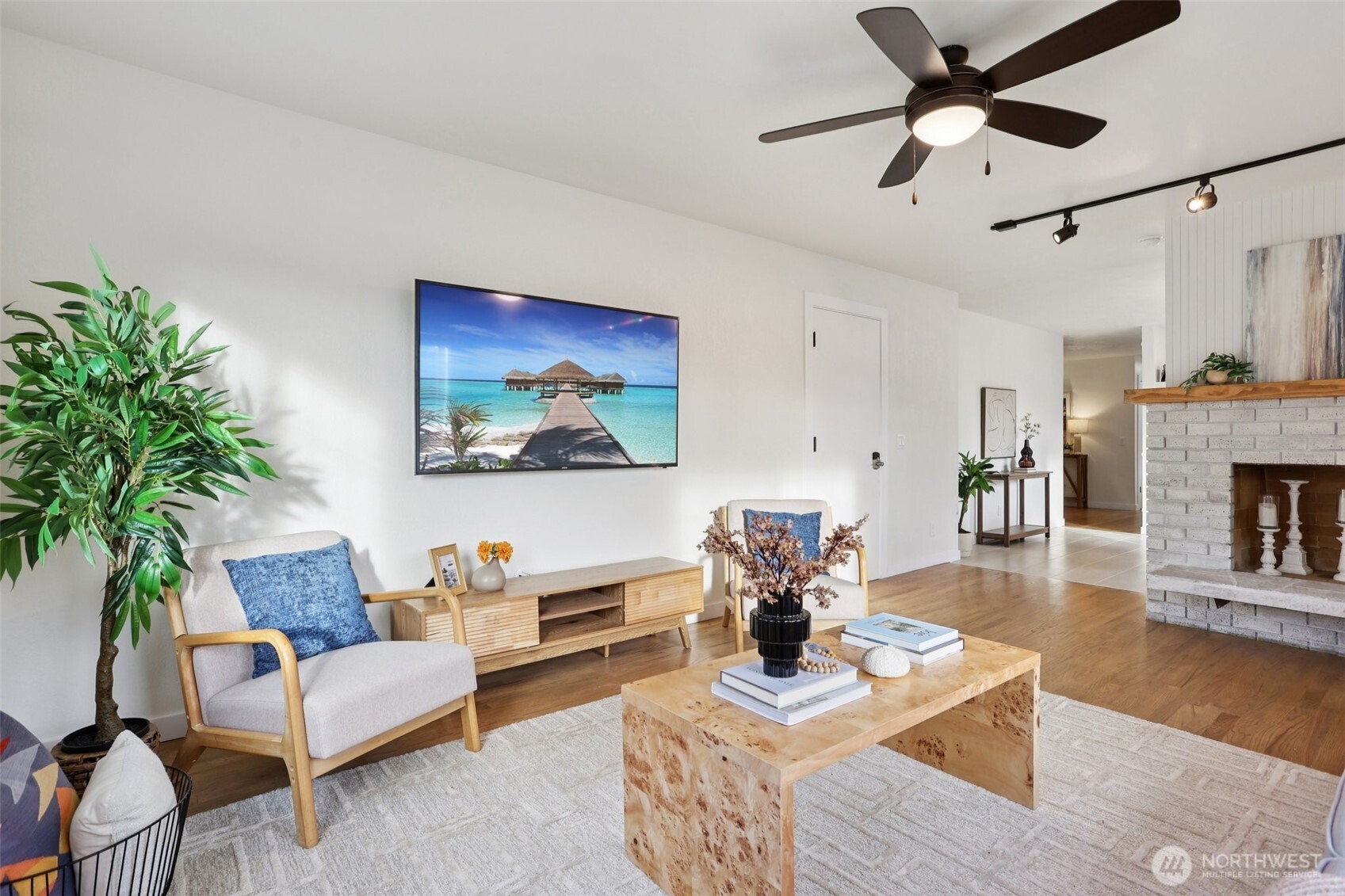 9002 34th Avenue Southwest Seattle, WA 98126 - Photo 21 of 39 a living room with furniture and a fireplace