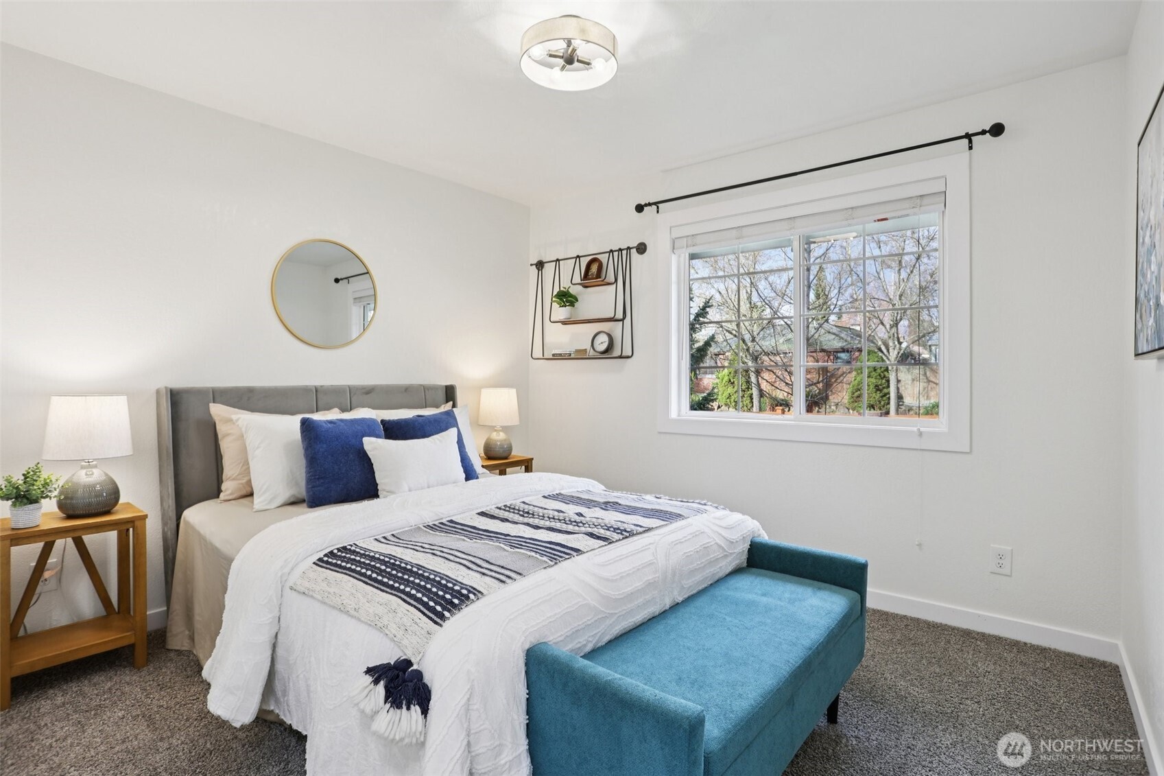 9002 34th Avenue Southwest Seattle, WA 98126 - Photo 23 of 39 a bedroom with a bed and a window