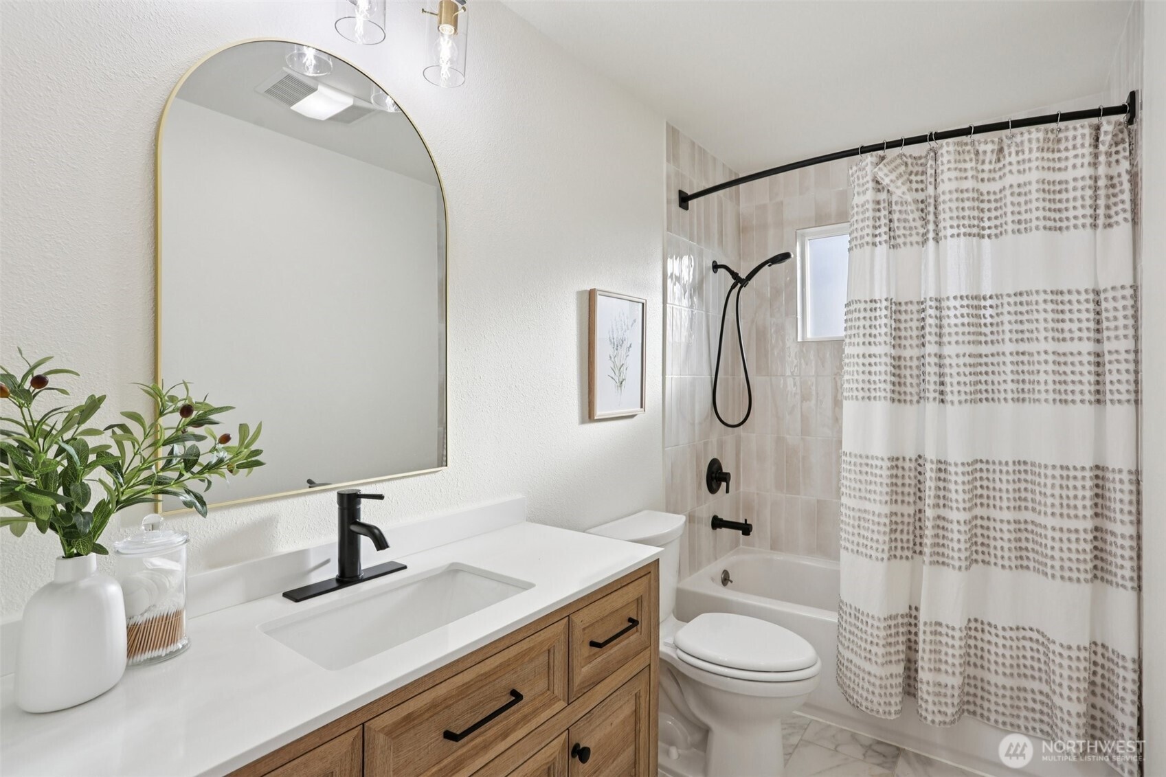 9002 34th Avenue Southwest Seattle, WA 98126 - Photo 24 of 39 a bathroom with a granite countertop sink a toilet and a mirror