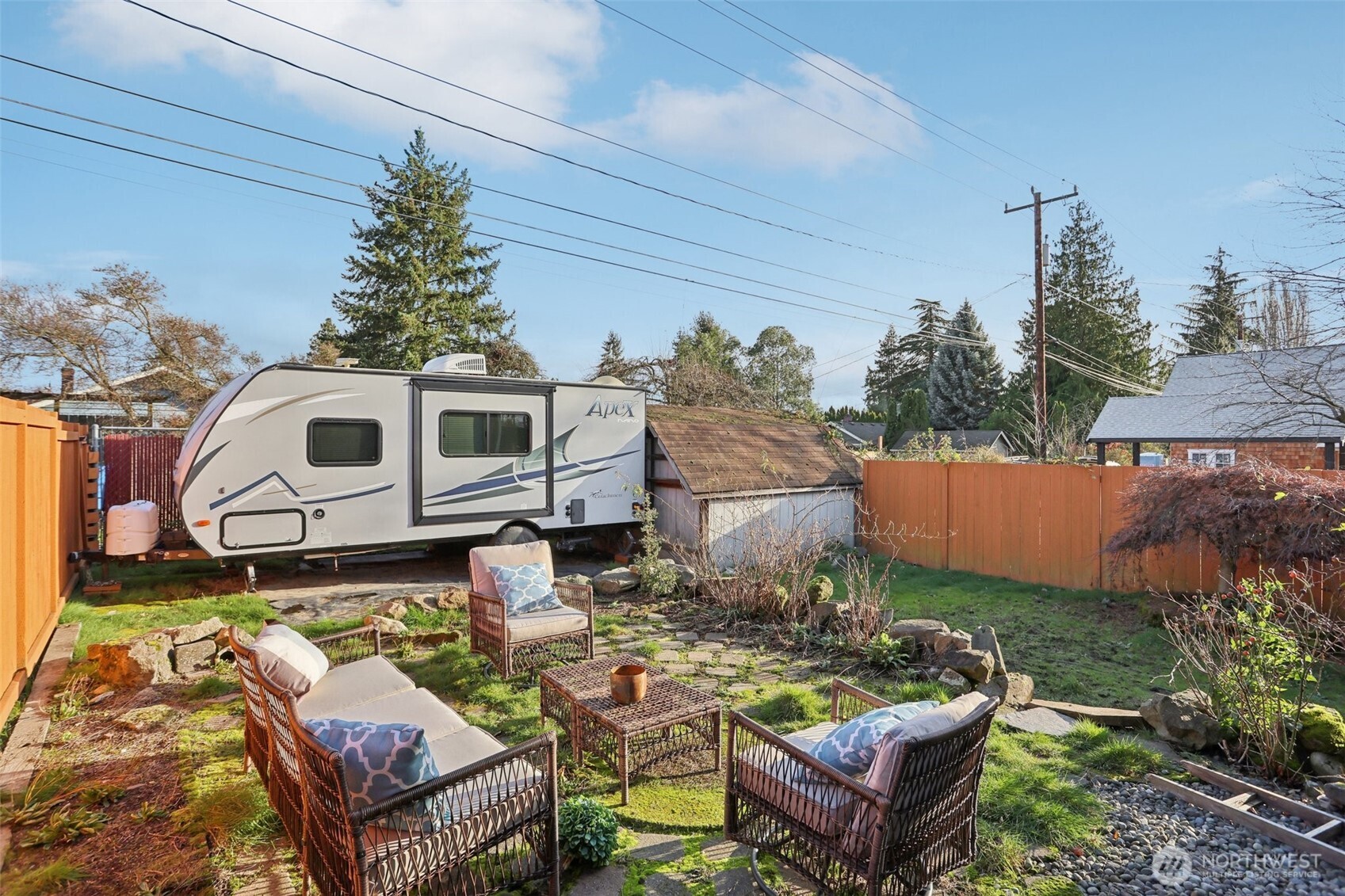 9002 34th Avenue Southwest Seattle, WA 98126 - Photo 32 of 39 aerial view of a house with backyard and sitting area