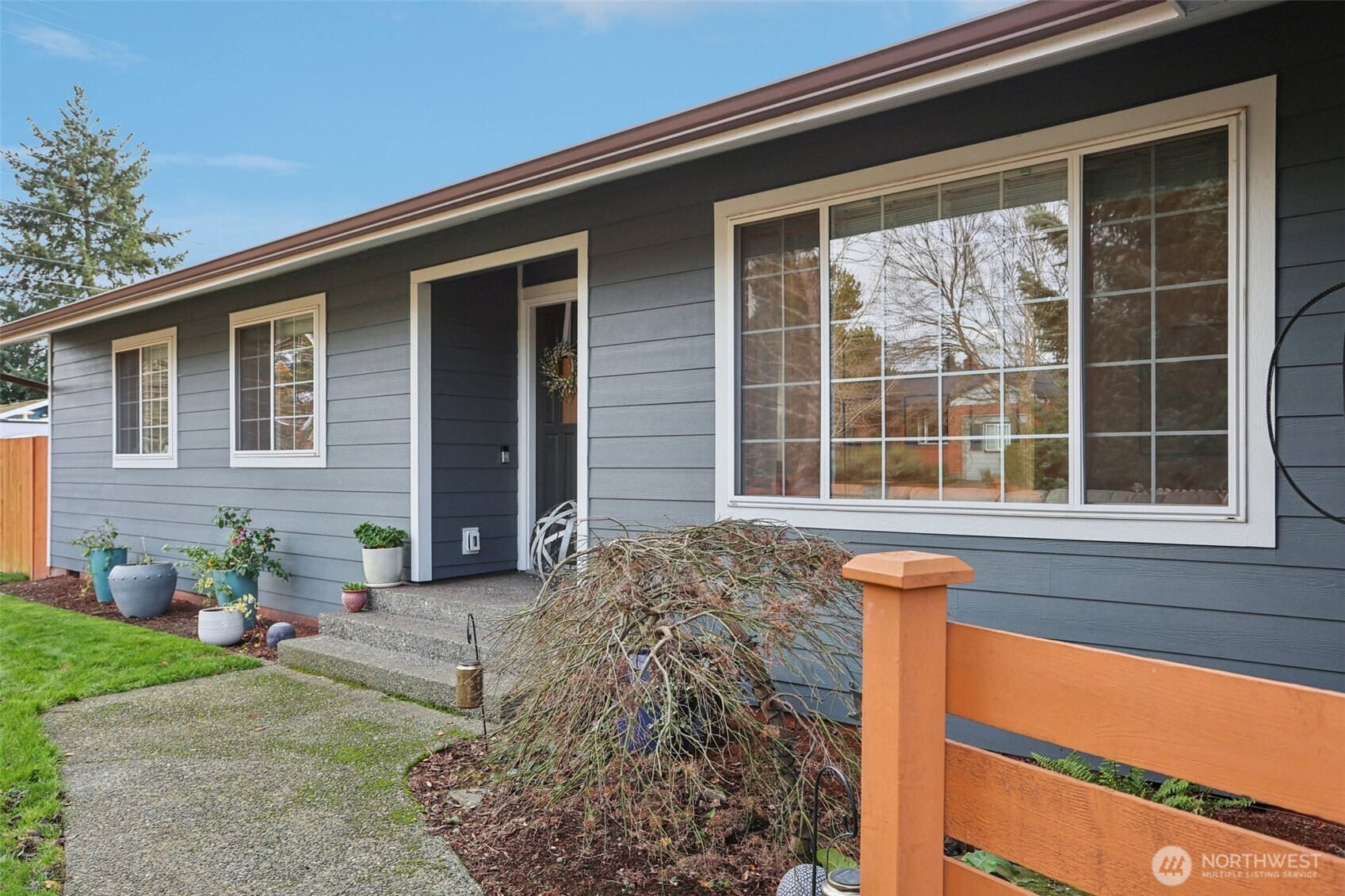 9002 34th Avenue Southwest Seattle, WA 98126 - Photo 37 of 39 a front view of a house with a yard