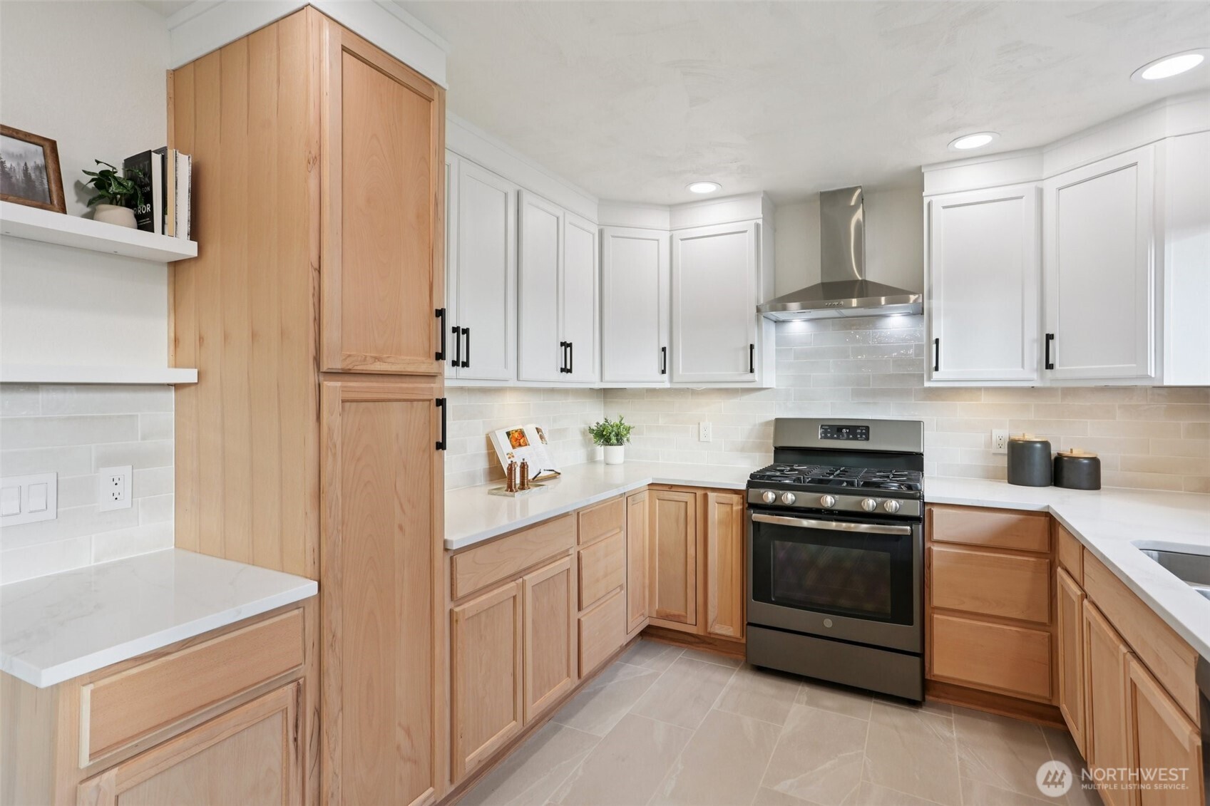 9002 34th Avenue Southwest Seattle, WA 98126 - Photo 5 of 39 a kitchen with white cabinets and white appliances