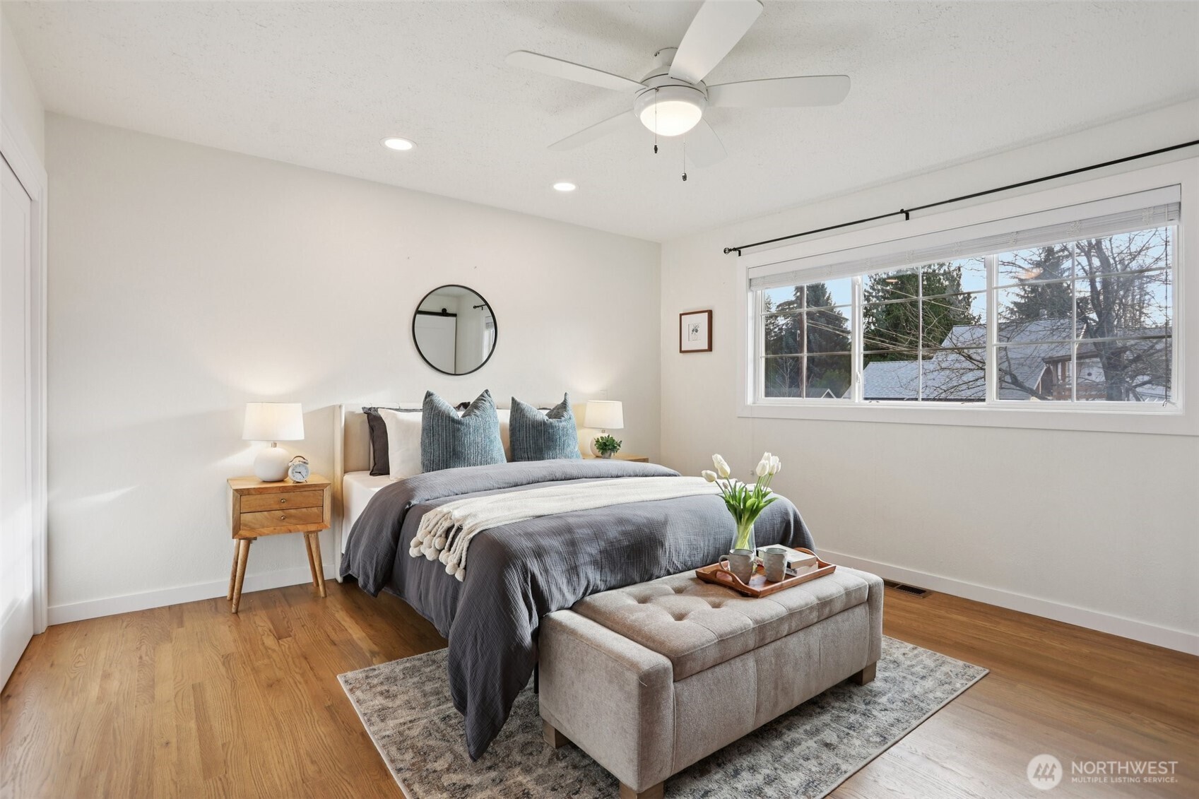 9002 34th Avenue Southwest Seattle, WA 98126 - Photo 6 of 39 a bed room with a bed couch and window
