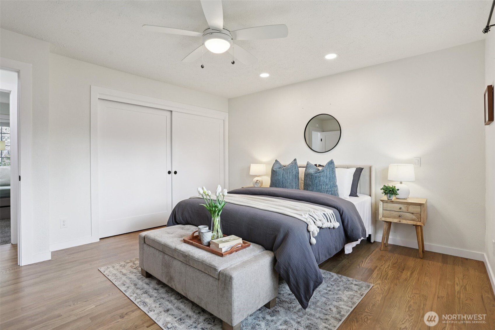 9002 34th Avenue Southwest Seattle, WA 98126 - Photo 7 of 39 a bedroom with bed and a chandelier