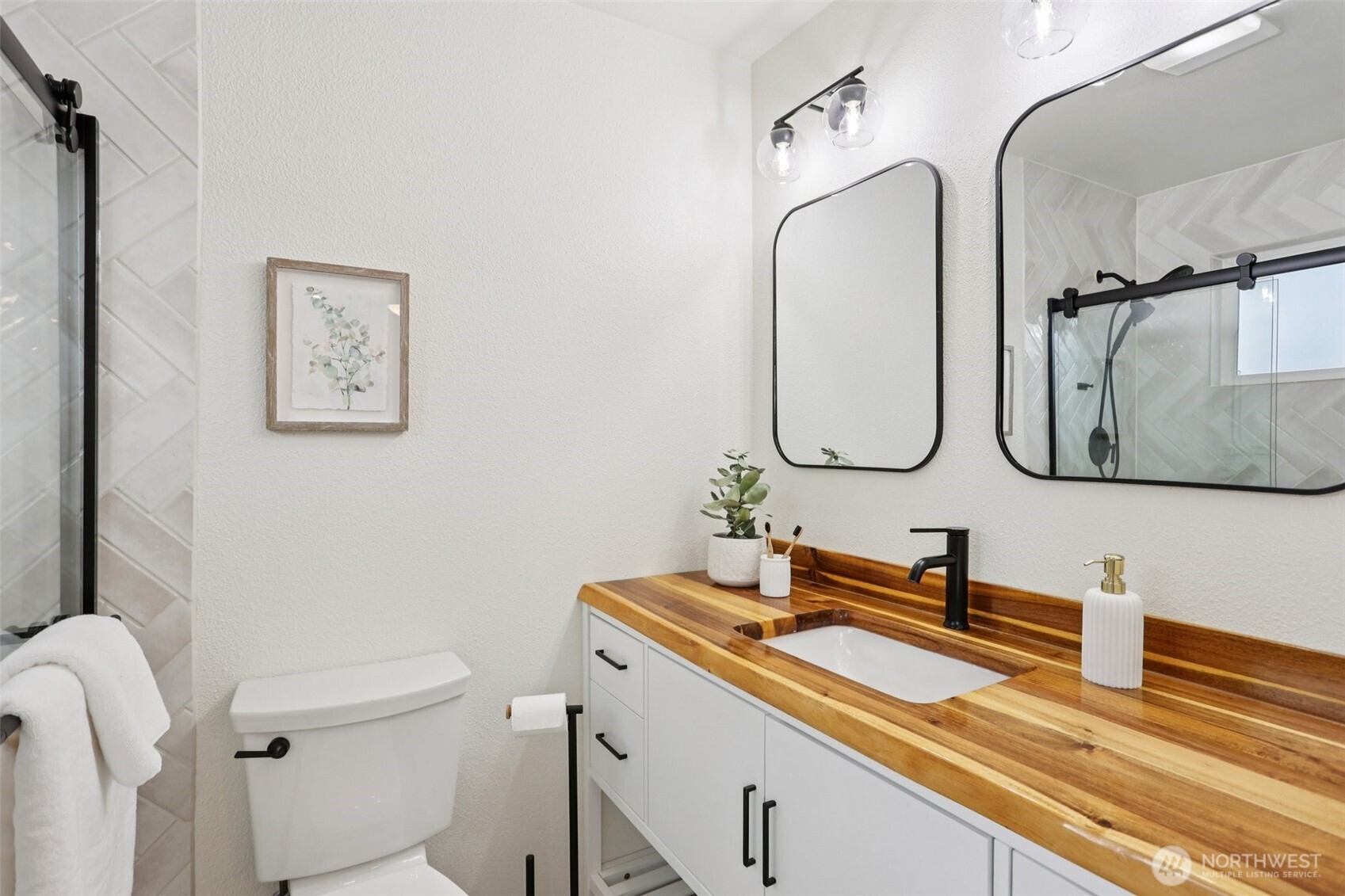 9002 34th Avenue Southwest Seattle, WA 98126 - Photo 10 of 39 a bathroom with a sink and a mirror