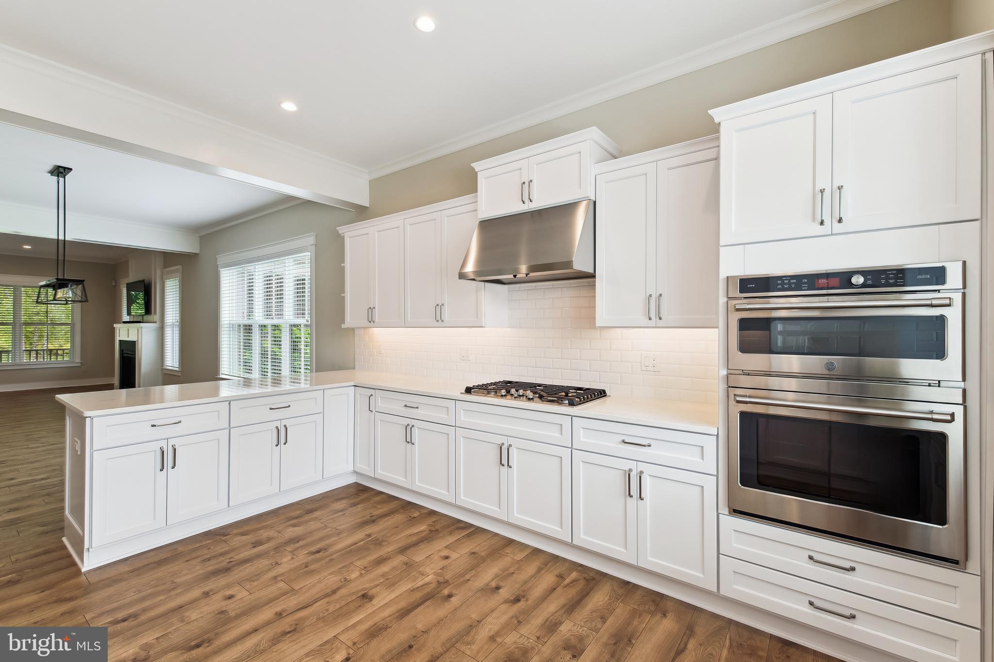 32871 Widgeon Road, Unit 15 Ocean View, DE 19970 - Photo 12 of 91 clean, crisp white cabinets, dbl ovens, gas cktop
