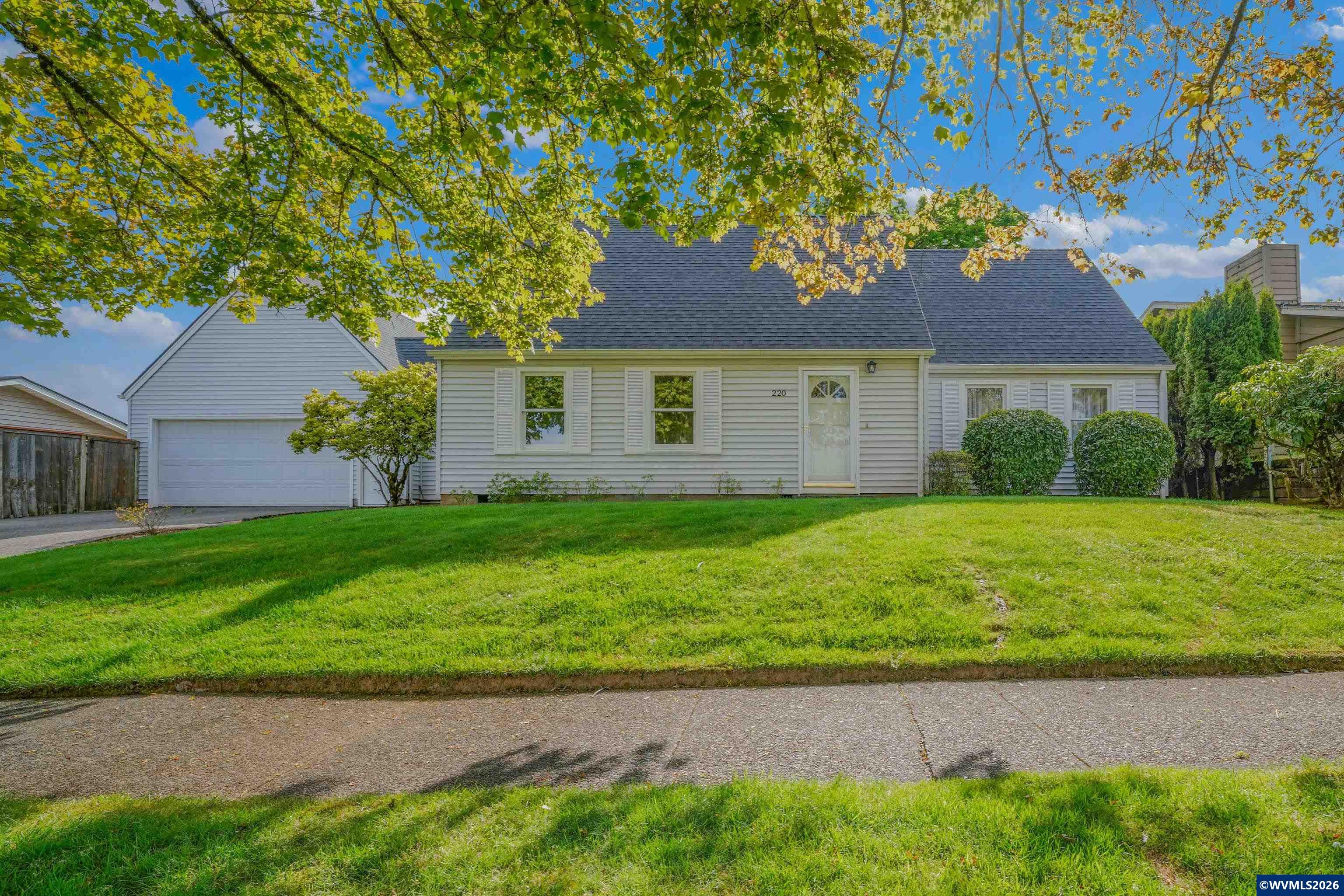 220 Northwest Downy Drive Sublimity, OR 97385 - Photo 3 of 47 a front view of a house with garden