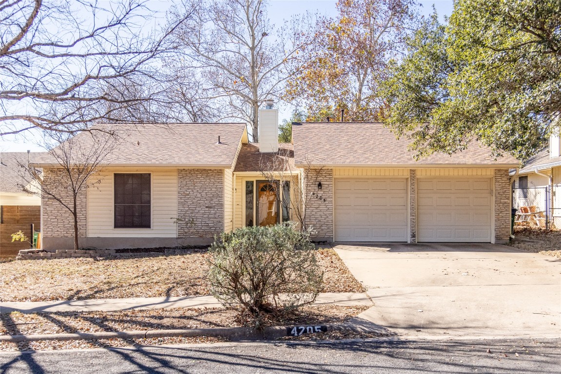 4205 Steve Scarbrough Drive Austin, TX 78759 - Photo 1 of 25 a front view of a house with a yard and garage