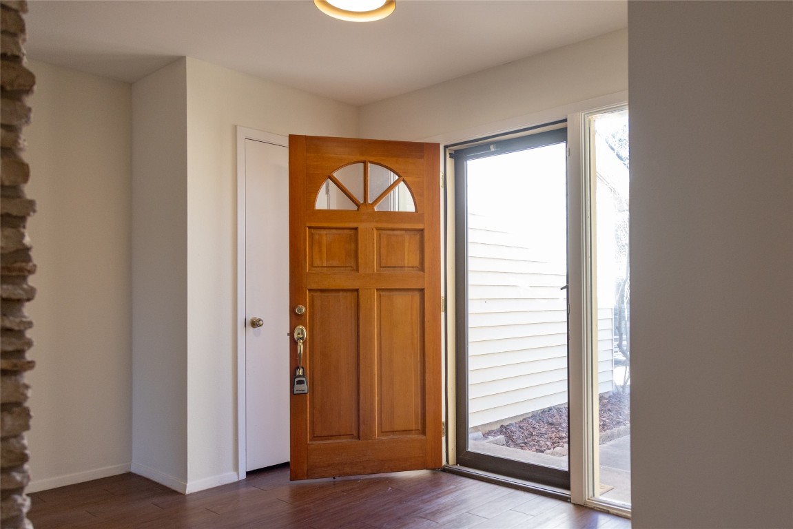 4205 Steve Scarbrough Drive Austin, TX 78759 - Photo 12 of 25 a view of front door with wooden floor