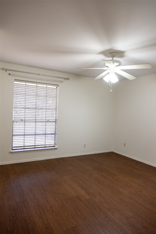4205 Steve Scarbrough Drive Austin, TX 78759 - Photo 15 of 25 an empty room with wooden floor and windows