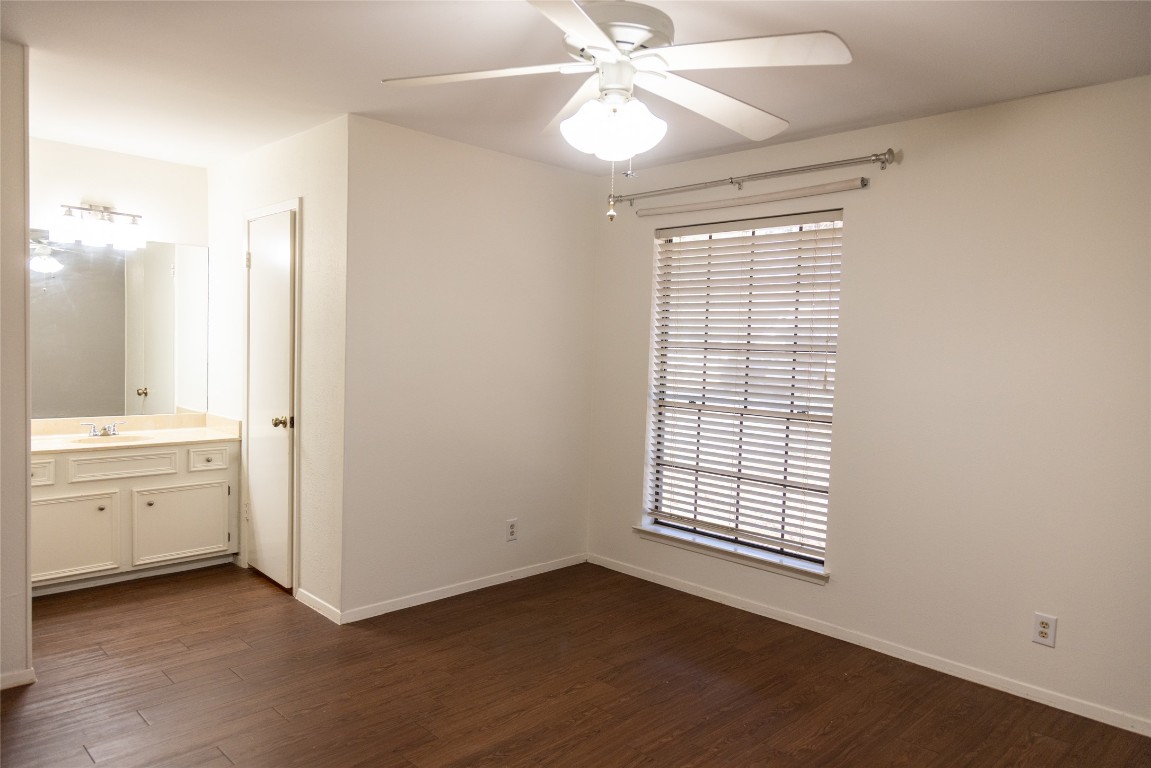 4205 Steve Scarbrough Drive Austin, TX 78759 - Photo 18 of 25 a view of an empty room with window and cabinet