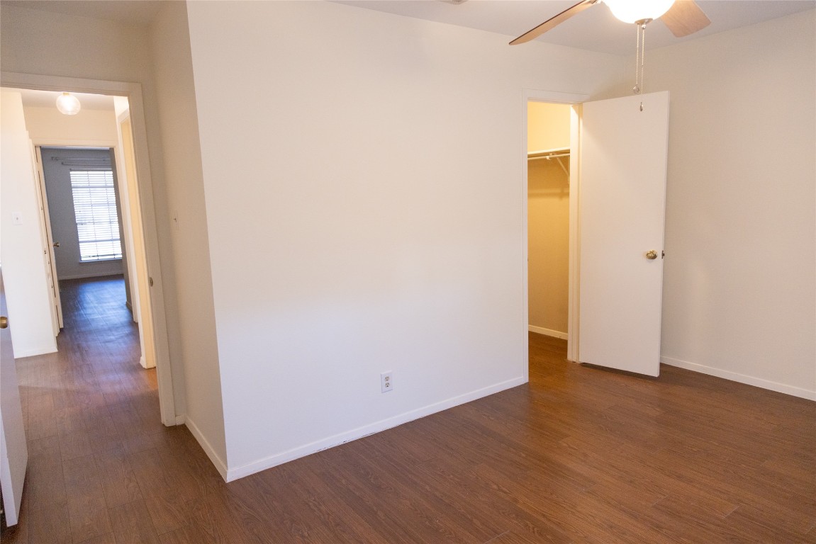 4205 Steve Scarbrough Drive Austin, TX 78759 - Photo 21 of 25 a view of a room with wooden floor