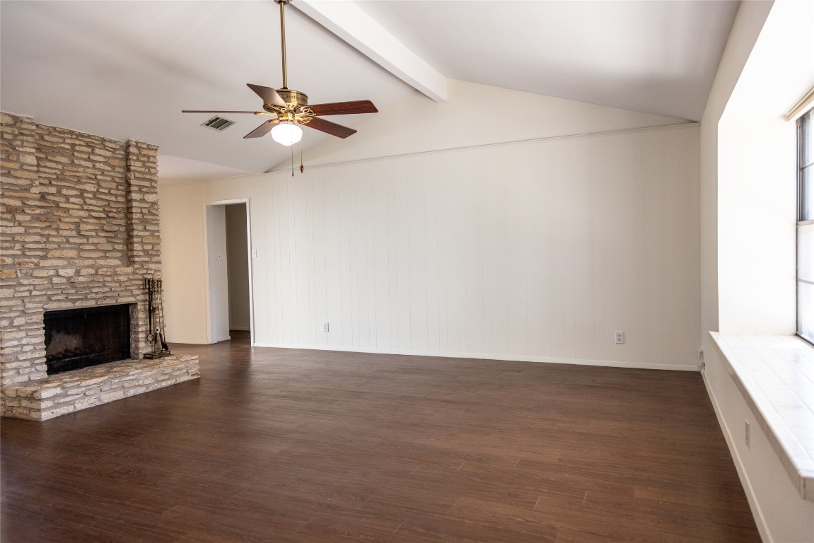 4205 Steve Scarbrough Drive Austin, TX 78759 - Photo 7 of 25 a view of an empty room with a fireplace and a window