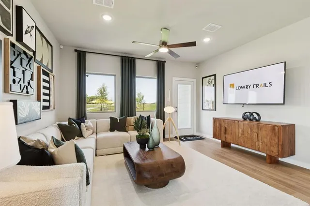 a living room with furniture and a large window