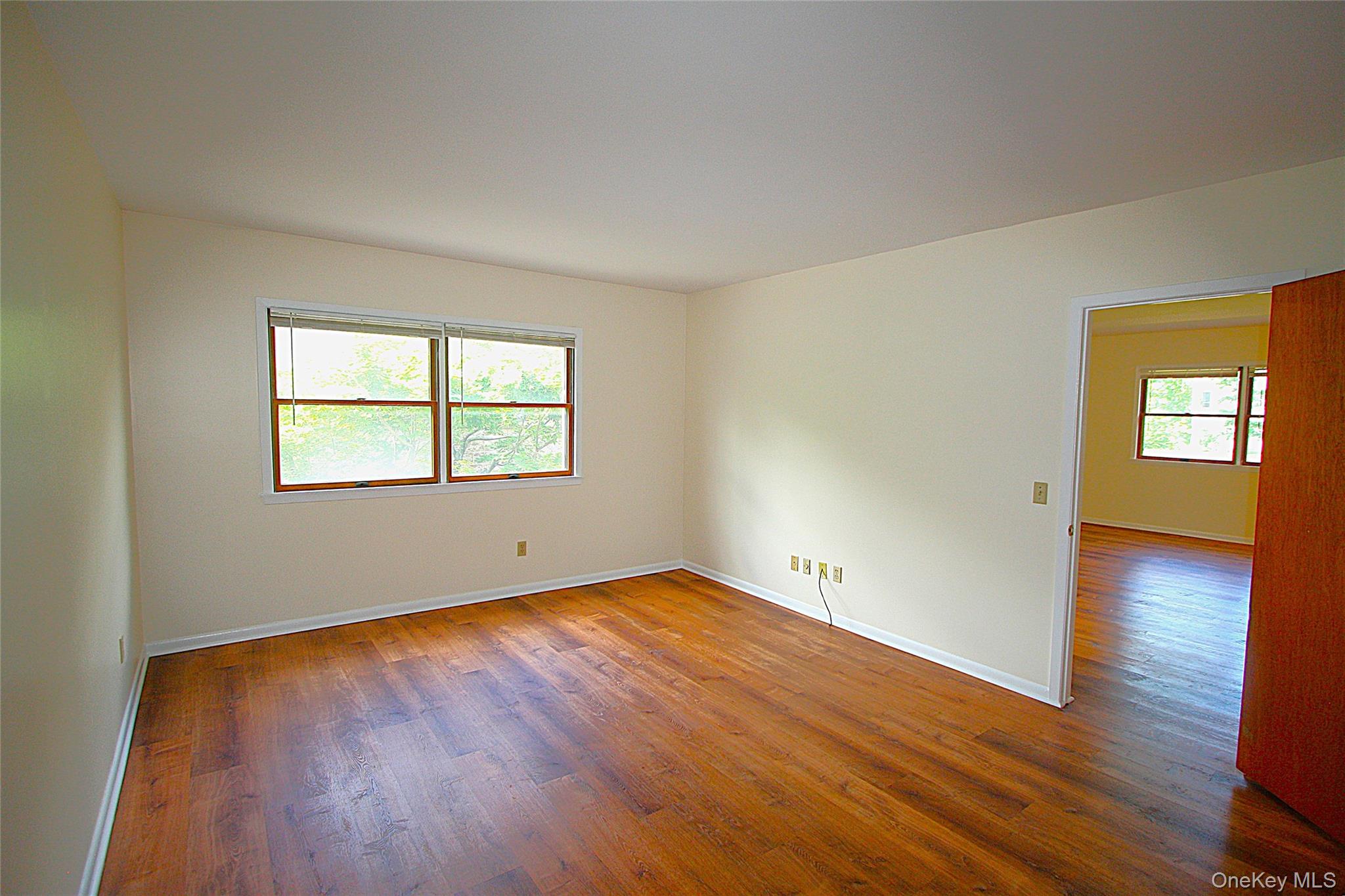 3115 Albany Post Road, Unit 2 Buchanan, NY 10511 - Photo 7 of 15 The deep bedroom has large windows looking down to the tree lined courtyard.
