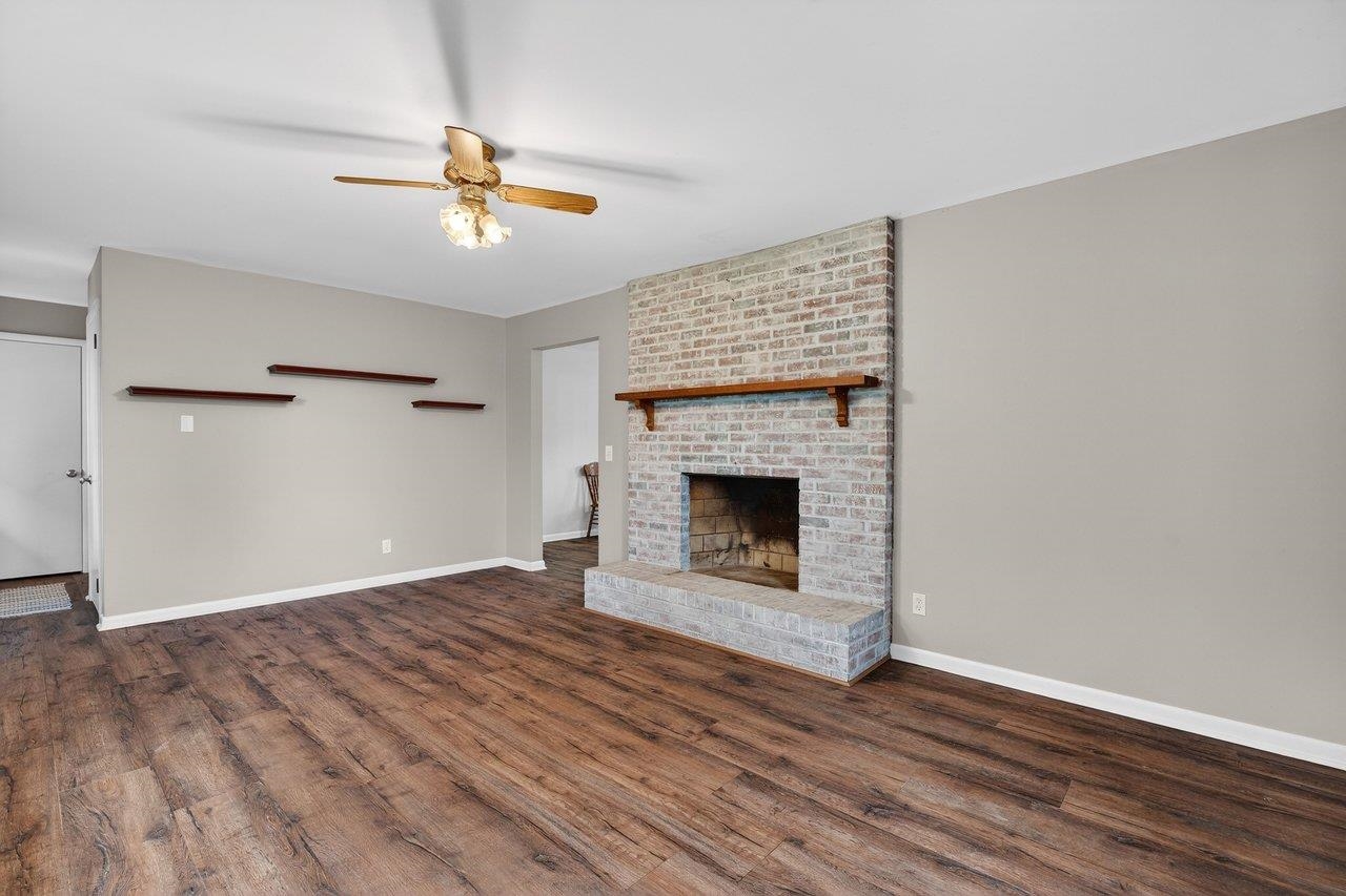 3259 Zion Church Road Broadway, VA 22815 - Photo 5 of 48 wooden floor in an empty room with a fireplace