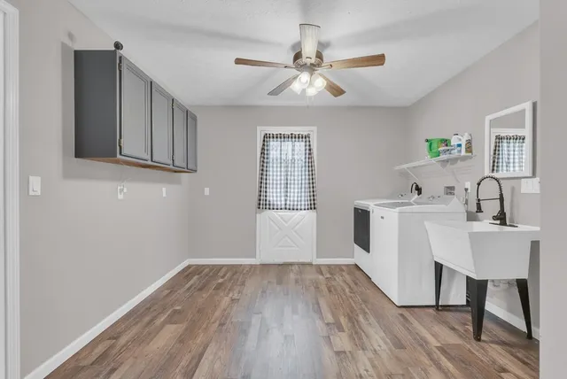 a view of hallway with wooden floor