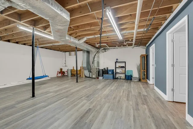 a view of a room with wooden floor