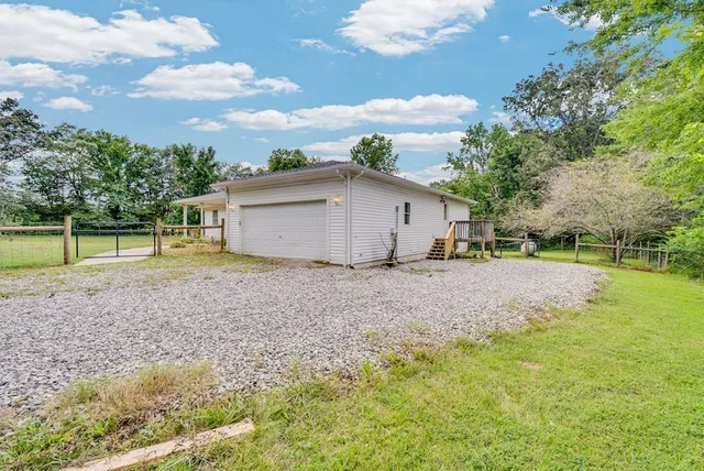 a view of a tree in front of a house