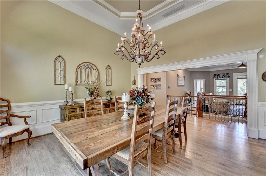 2850 Roanoke Road Cumming, GA 30041 - Photo 28 of 91 a view of a dining room with furniture and wooden floor