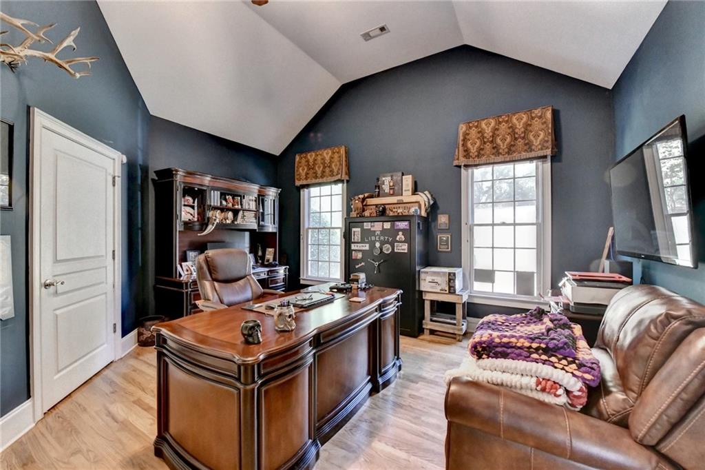 2850 Roanoke Road Cumming, GA 30041 - Photo 29 of 91 a living room with furniture and a flat screen tv