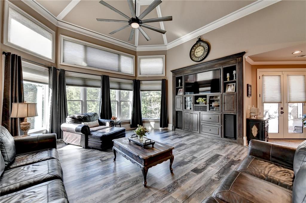 2850 Roanoke Road Cumming, GA 30041 - Photo 54 of 91 a living room with furniture a large window and table