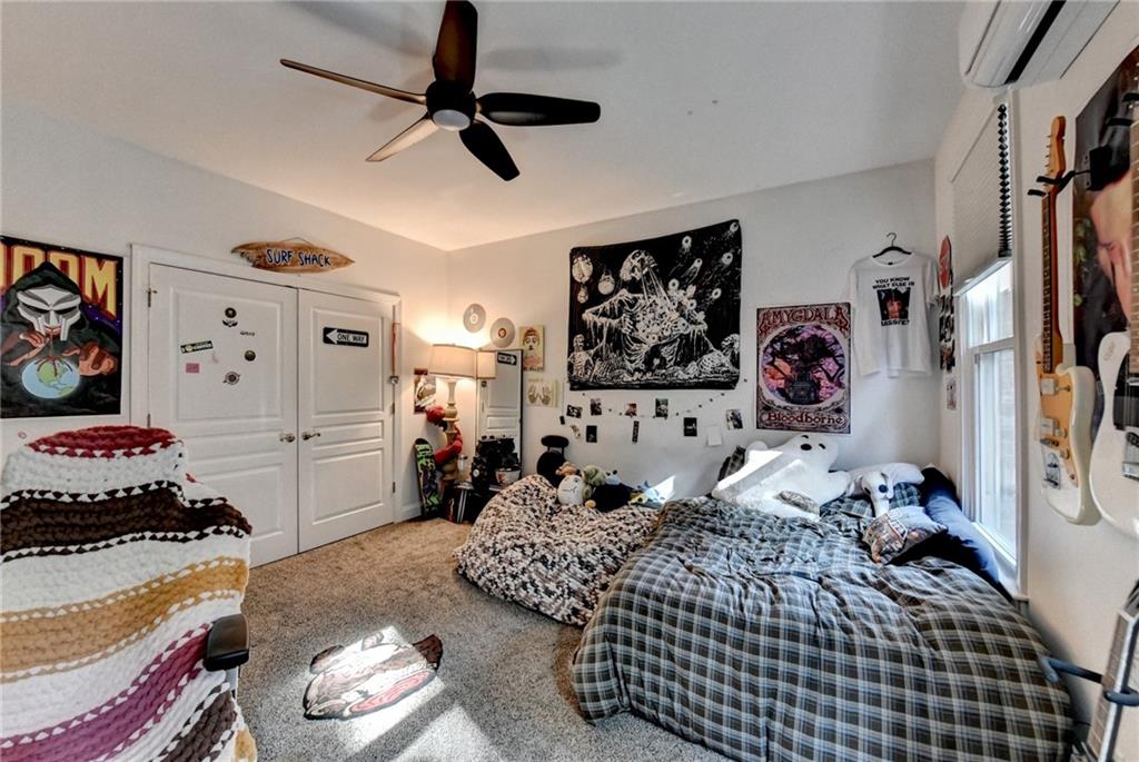 2850 Roanoke Road Cumming, GA 30041 - Photo 62 of 91 a bedroom with a bed and a walk in closet