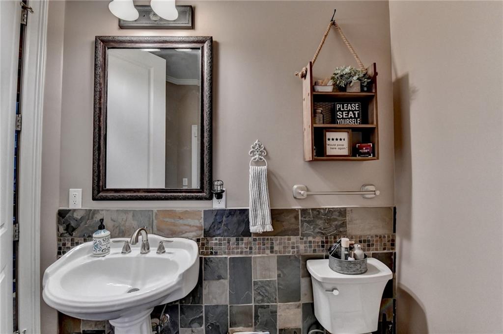 2850 Roanoke Road Cumming, GA 30041 - Photo 79 of 91 a bathroom with a sink and a mirror