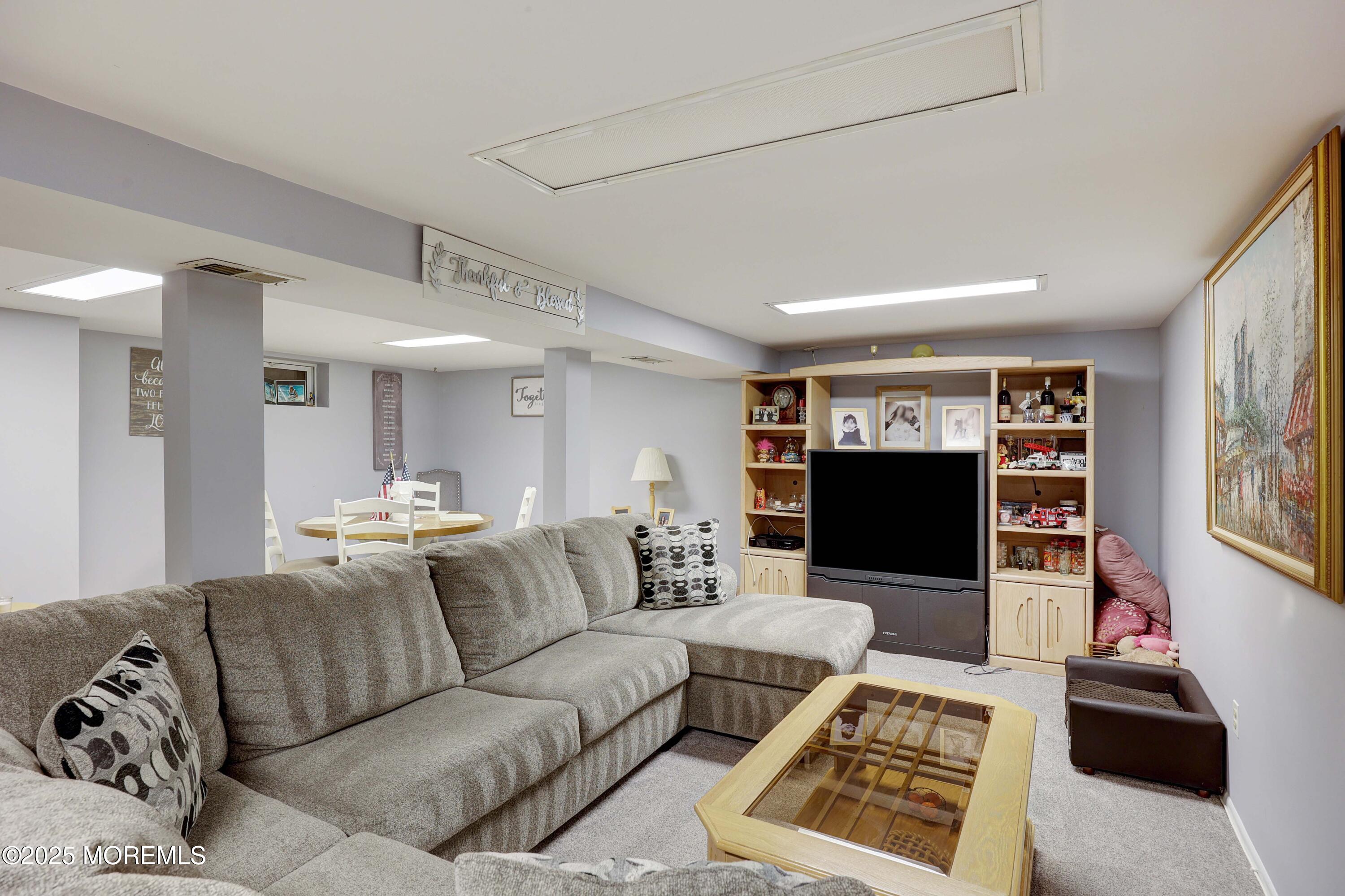 51 Alan Terrace Howell, NJ 07731 - Photo 20 of 32 a living room with furniture and a flat screen tv