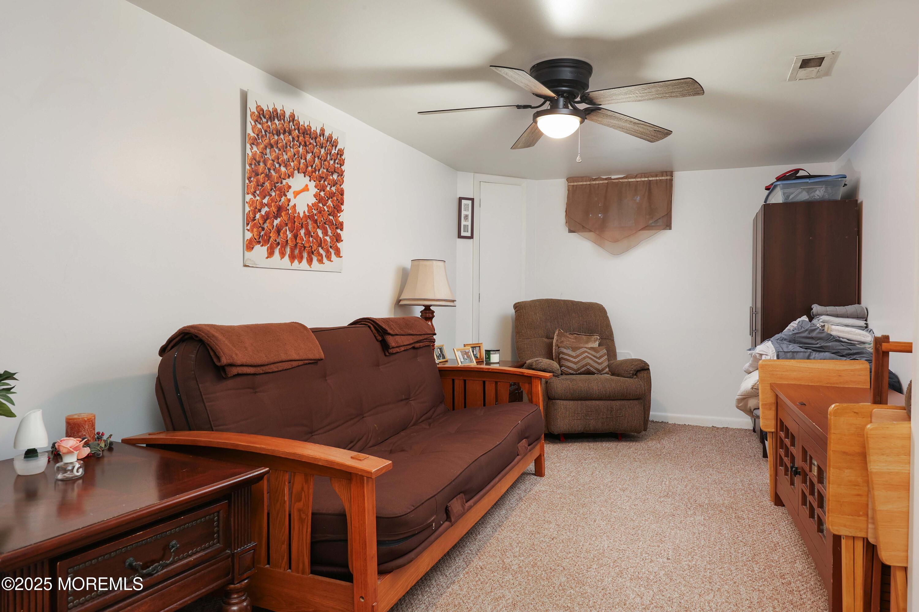 51 Alan Terrace Howell, NJ 07731 - Photo 21 of 32 a living room with furniture and a ceiling fan